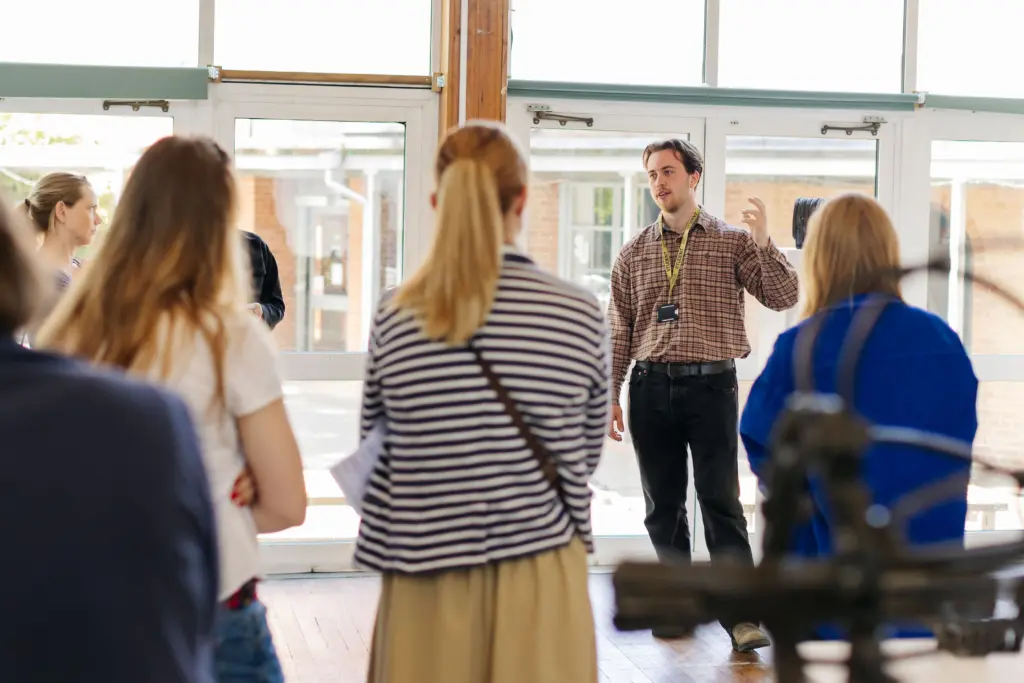 Student ambassador leading a tour on an UG Open Day