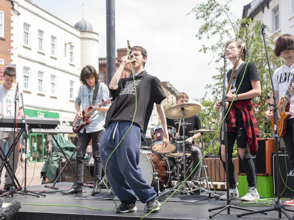 A band made up of HCA Music students performs live in Hereford city centre.