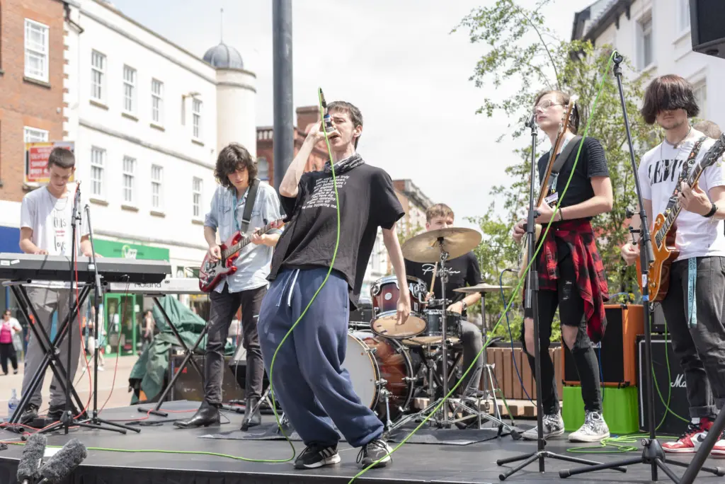A band made up of HCA Music students performs live in Hereford city centre.