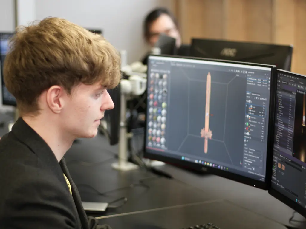 Student working in the digital design suite at HCA