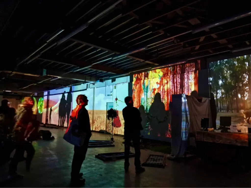 The creative media show featuring a variety of student work projection mapped around the room.