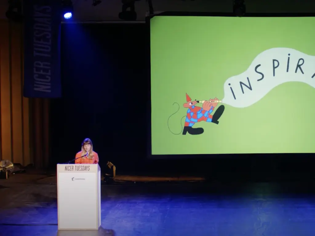 Aysha Tengiz on stage at Nicer Tuesdays