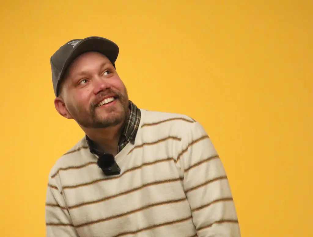 Nicholas Stevenson against a yellow background