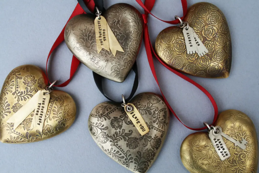 A collection of etched metal Christmas decorations.
