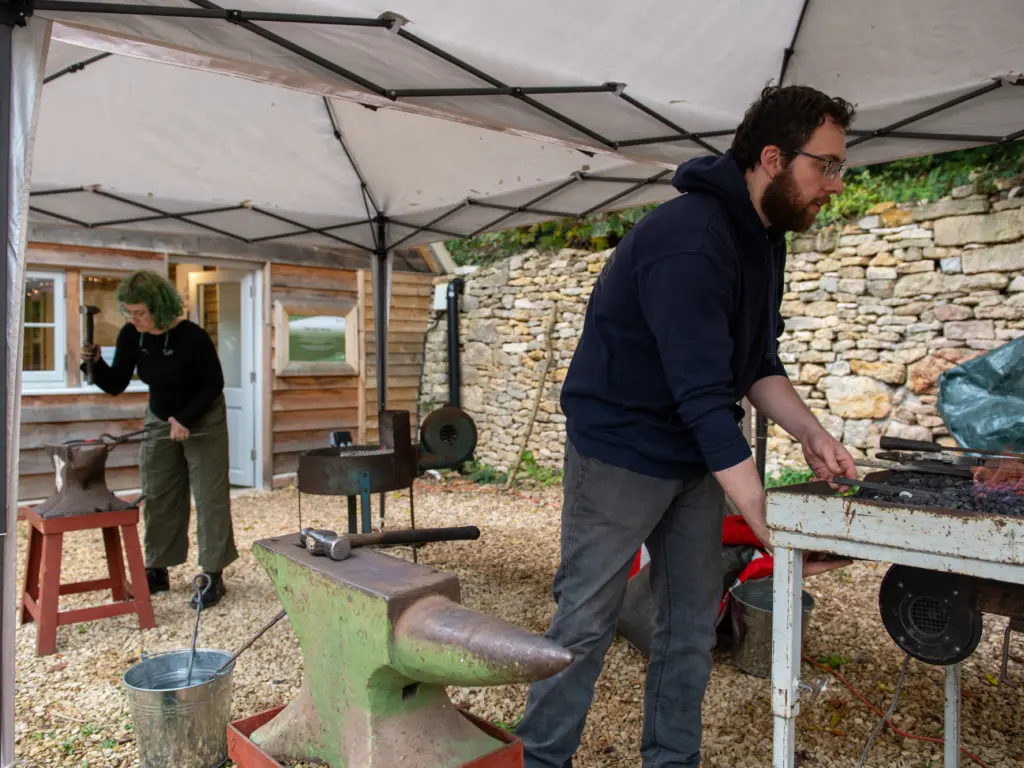 Ren Garside and Mark Rogers forging on site at Hawkwood College (photo: Oliver Cameron-Swan)