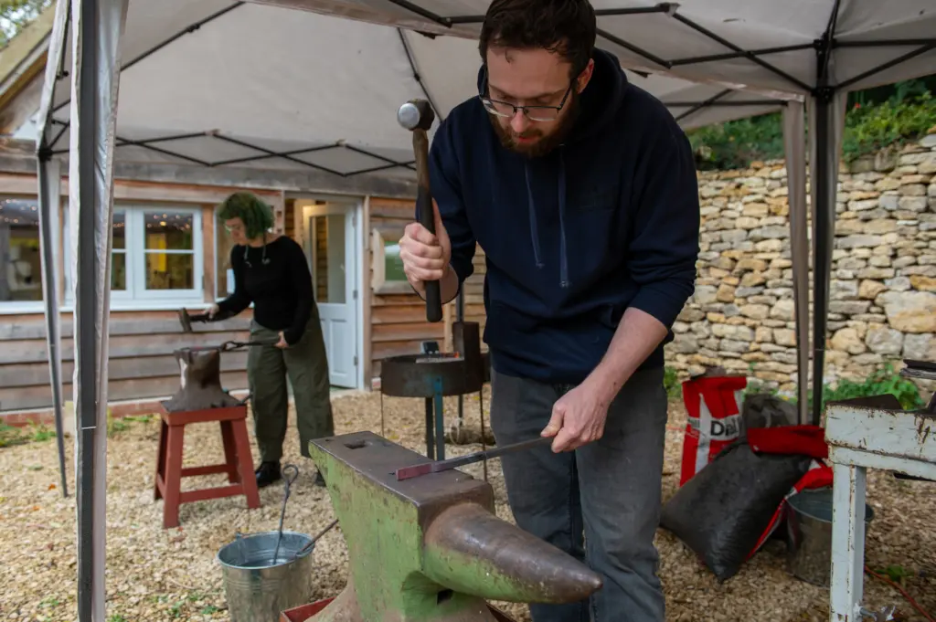 Ren Garside and Mark Rogers forging on site at Hawkwood College (photo: Oliver Cameron-Swan)