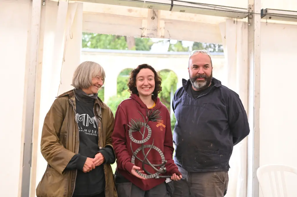 L to R – Lesley Greene, co-ordinator of Earth Fire Iron, Neve Taylor-Bridges holding the maquette of her sculpture, Adam Greenwell AWCB LWCB. (photo. Oliver Cameron-Swan)