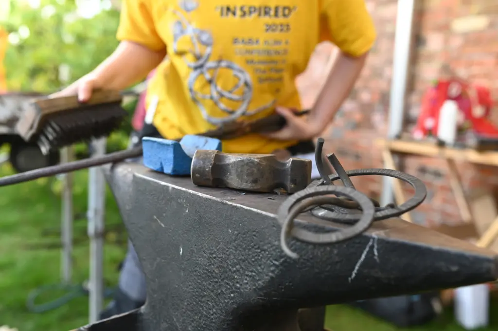 Pictures of Neve Taylor-Bridges making her sculpture as part of the live forging at the BABA annual conference at the Museum in the Park, Stroud. (photos by Lewis Poor)