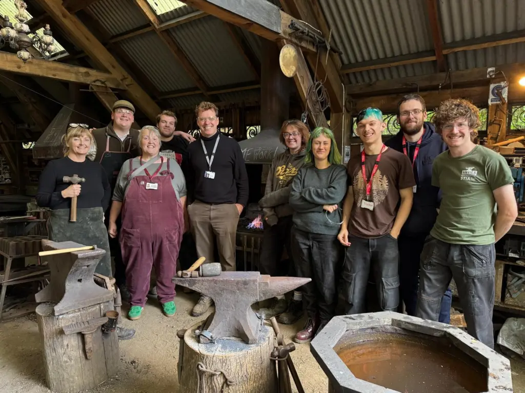 Image showing Del Done MBE CWCB (HCA Head of School of Materials & Design, Artist Blacksmithing/Forged Metal Arts course leader), Dan Austin and Abigail Fallis (Ruskin College tutors) HCA Forged Metal Arts students and Ruskin Mill College students (photo: Oliver Cameron-Swan)