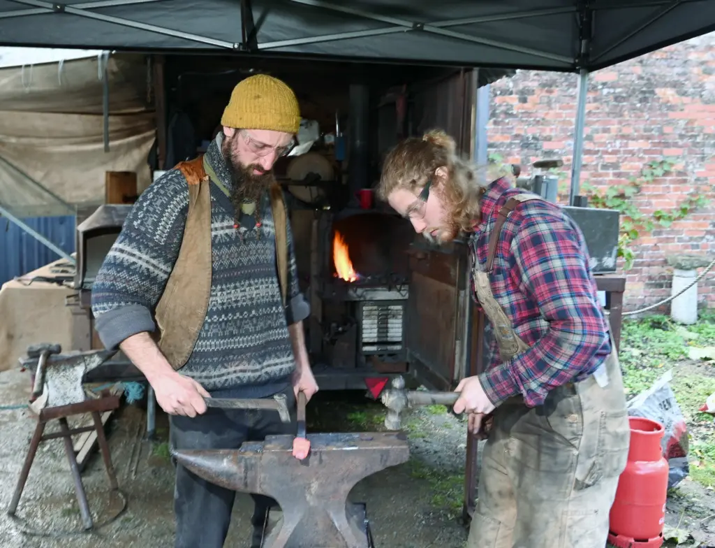 Simon Bushell and Joe Robinson demonstrating hot metal forging (photos. Simon Pizzey)